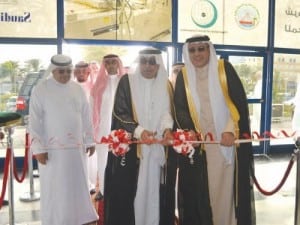 Director General of Agricultural Affairs of the Makkah Al Mukarramah region Engineer Hassan Bin Obaid Sankouf (middle) cuts the ceremonial ribbon, assisted by ACE vice president for events and exhibitions Walid Wakid (right)