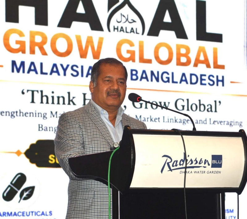 Man standing at a podium at a press conference.