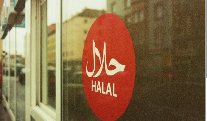 Red Halal sign on window.